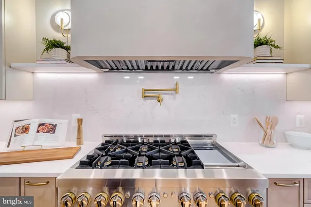 a bathroom with a toilet a sink and a mirror