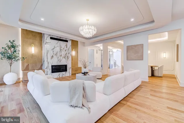a spacious bathroom with a double vanity sink mirror and bathtub