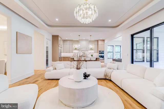 a view of a bedroom with wooden floor