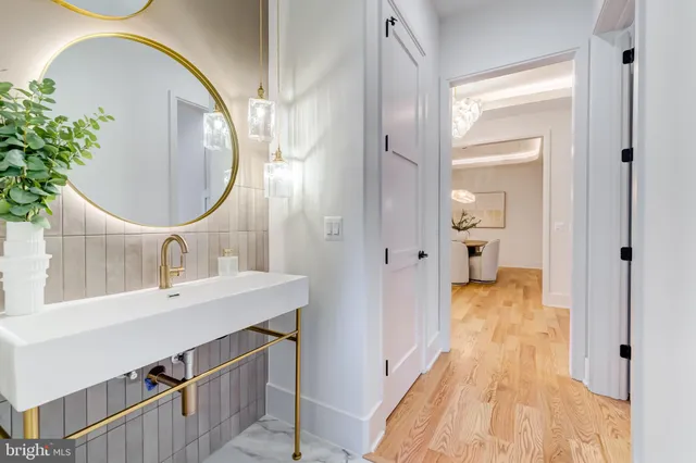 a view of empty room with wooden floor and windows