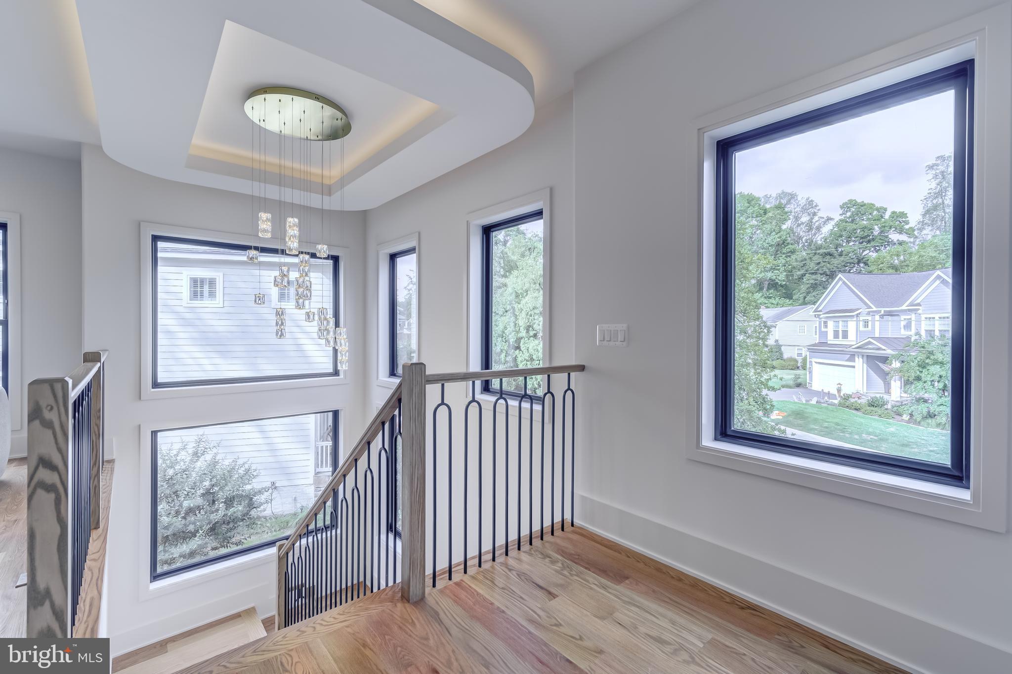 913 Symphony Circle Southwest Vienna, VA 22180 - Photo 55 of 150 a view of an empty room with wooden floor and a window