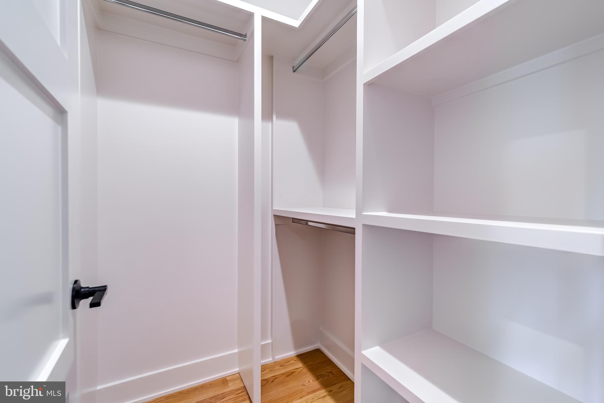 913 Symphony Circle Southwest Vienna, VA 22180 - Photo 65 of 150 a view of walk in closet with empty racks