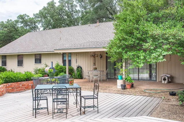 a view of house with a patio