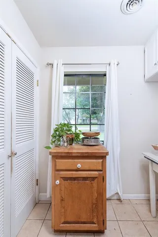 a view of washer and dryer with kitchen in the background
