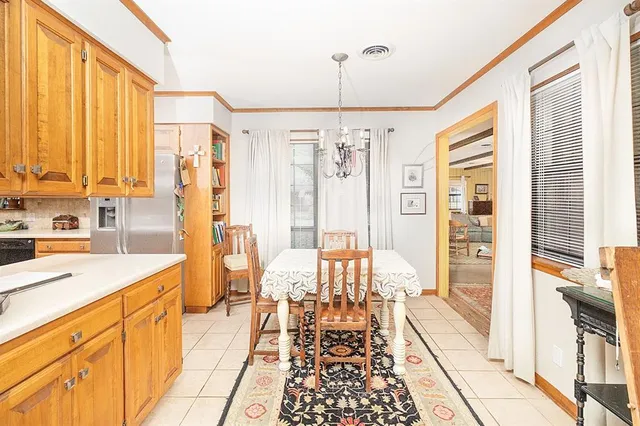 a large kitchen with a large window and furniture
