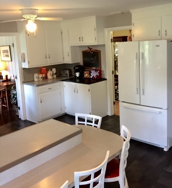 10 Ridgeway Circle Springfield, MA 01118 - Photo 15 of 29 a kitchen with stainless steel appliances a refrigerator a stove a sink a dining table and chairs
