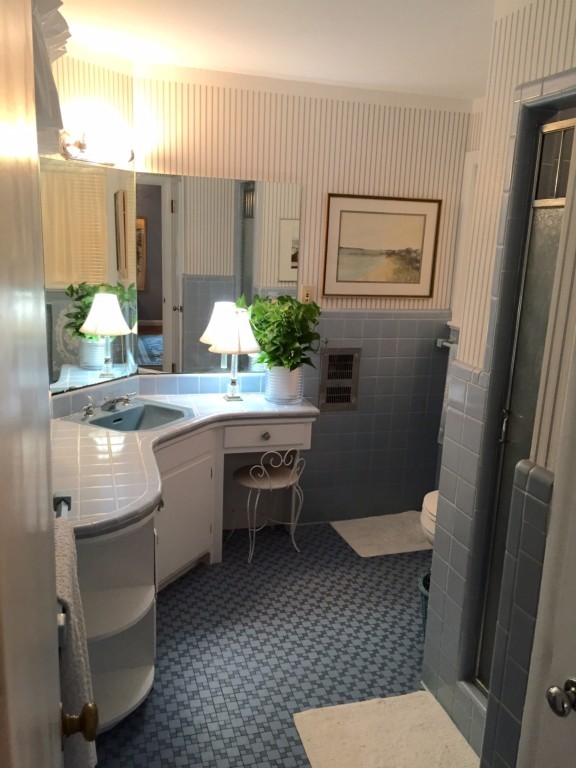 10 Ridgeway Circle Springfield, MA 01118 - Photo 17 of 29 a bathroom with a granite countertop toilet sink and mirror