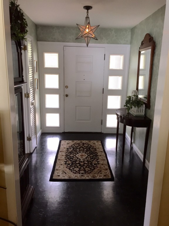 10 Ridgeway Circle Springfield, MA 01118 - Photo 2 of 29 a view of a hallway with wooden floor and dining room