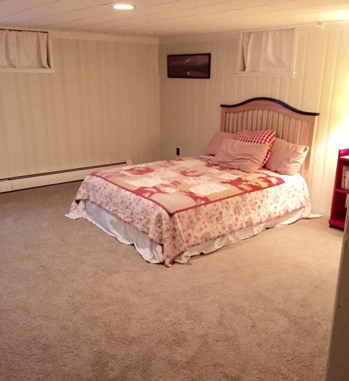 10 Ridgeway Circle Springfield, MA 01118 - Photo 21 of 29 a bed sitting in a bedroom next to a window