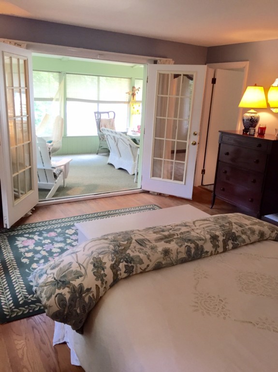 10 Ridgeway Circle Springfield, MA 01118 - Photo 9 of 29 a bedroom with a bed and wooden floor