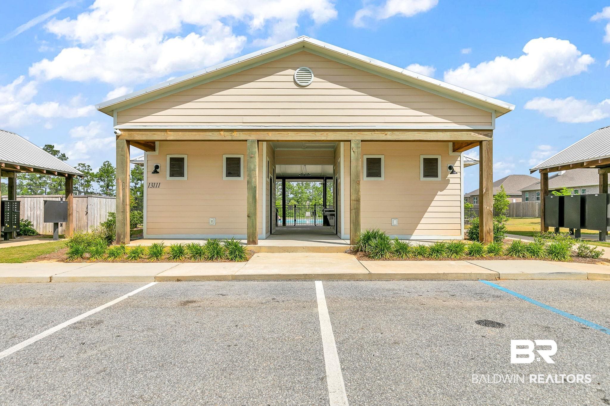13233 Ibis Boulevard Daphne, AL 36527 - Photo 78 of 100 Community building with siding exterior, metal roof, and covered entryways
