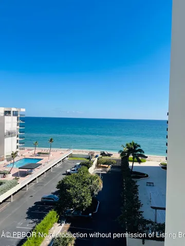 a bedroom with a bed a flat screen tv and a window