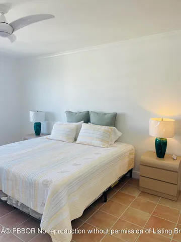 a view of a hallway with windows and cabinet