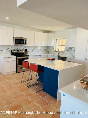 a living room with furniture rug and window