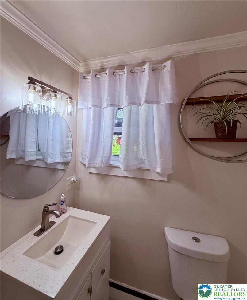 1275 Macada Road Bethlehem, PA 18017 - Photo 48 of 87 a bathroom with a sink a toilet and mirror