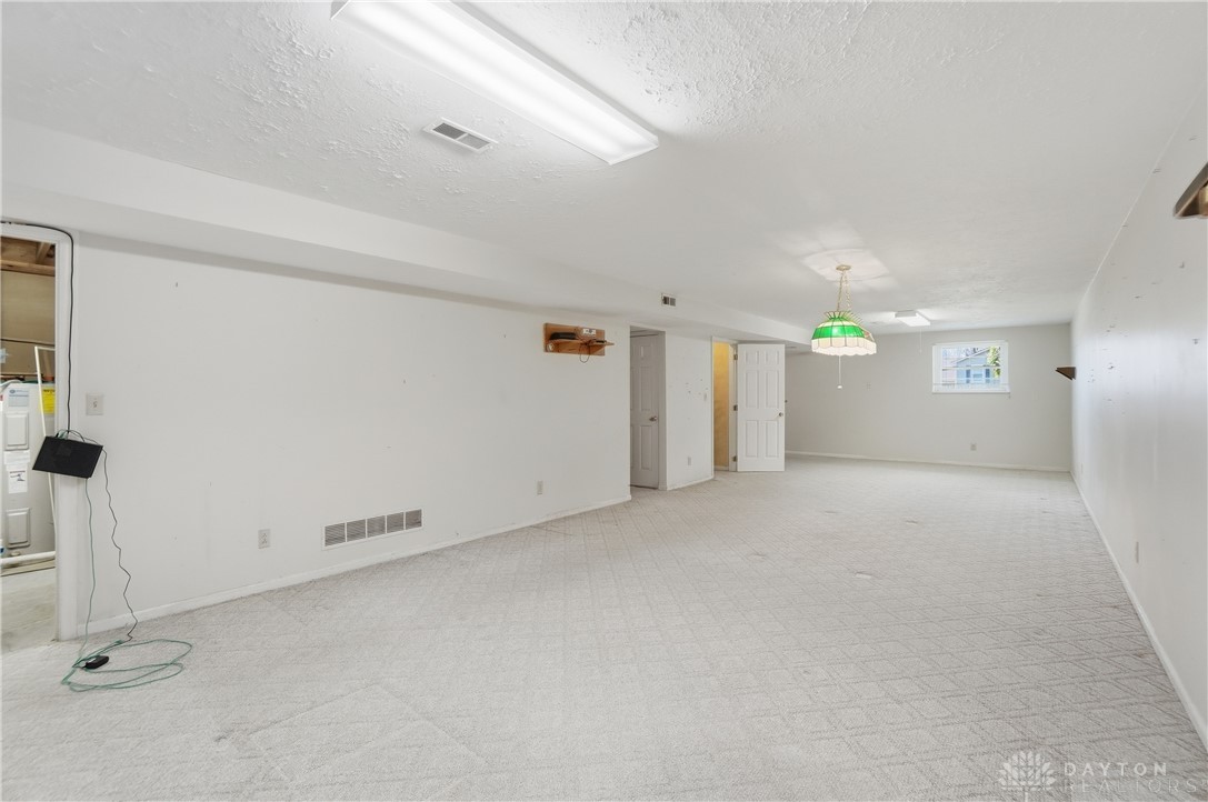 9964 Hummingbird Way Dayton, OH 45458 - Photo 45 of 57 This spacious basement offers a blank canvas for customization and future expansion.