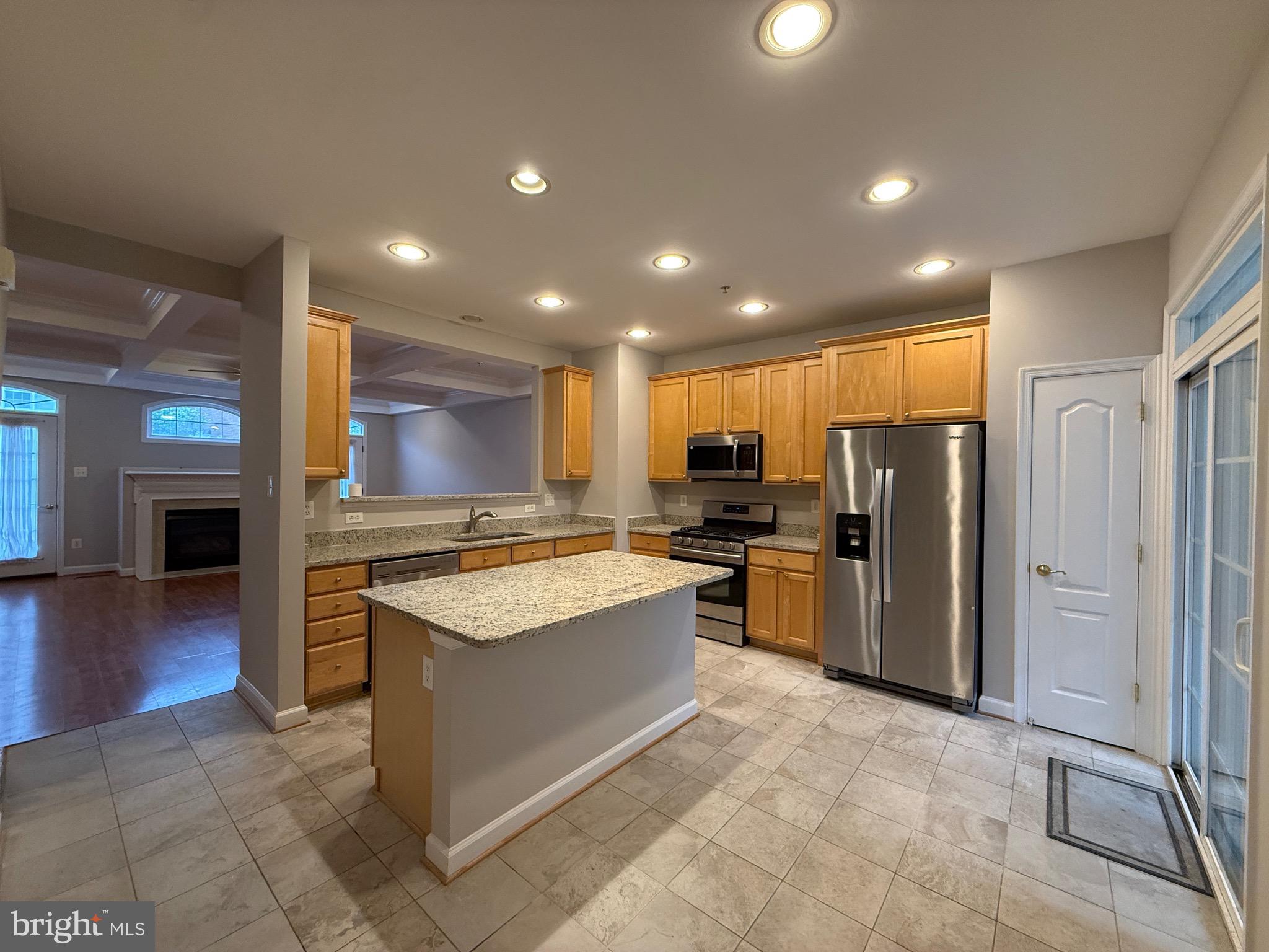 1127 Gaither Road Rockville, MD 20850 - Photo 11 of 26 a kitchen with stainless steel appliances granite countertop a refrigerator and a stove