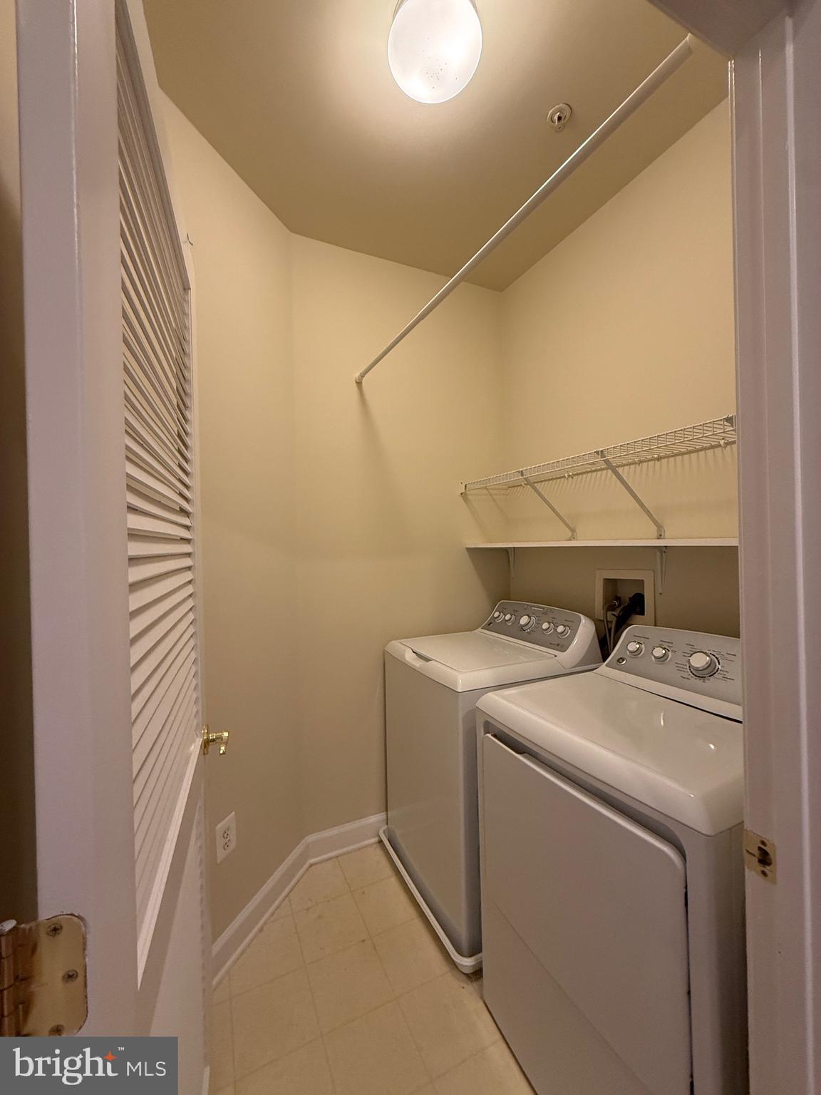 1127 Gaither Road Rockville, MD 20850 - Photo 20 of 26 a utility room with dryer and washer