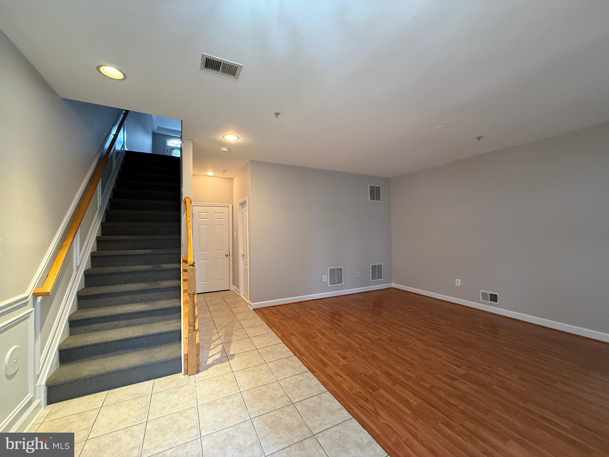 1127 Gaither Road Rockville, MD 20850 - Photo 3 of 26 a view of an empty room with stairs and ventilation