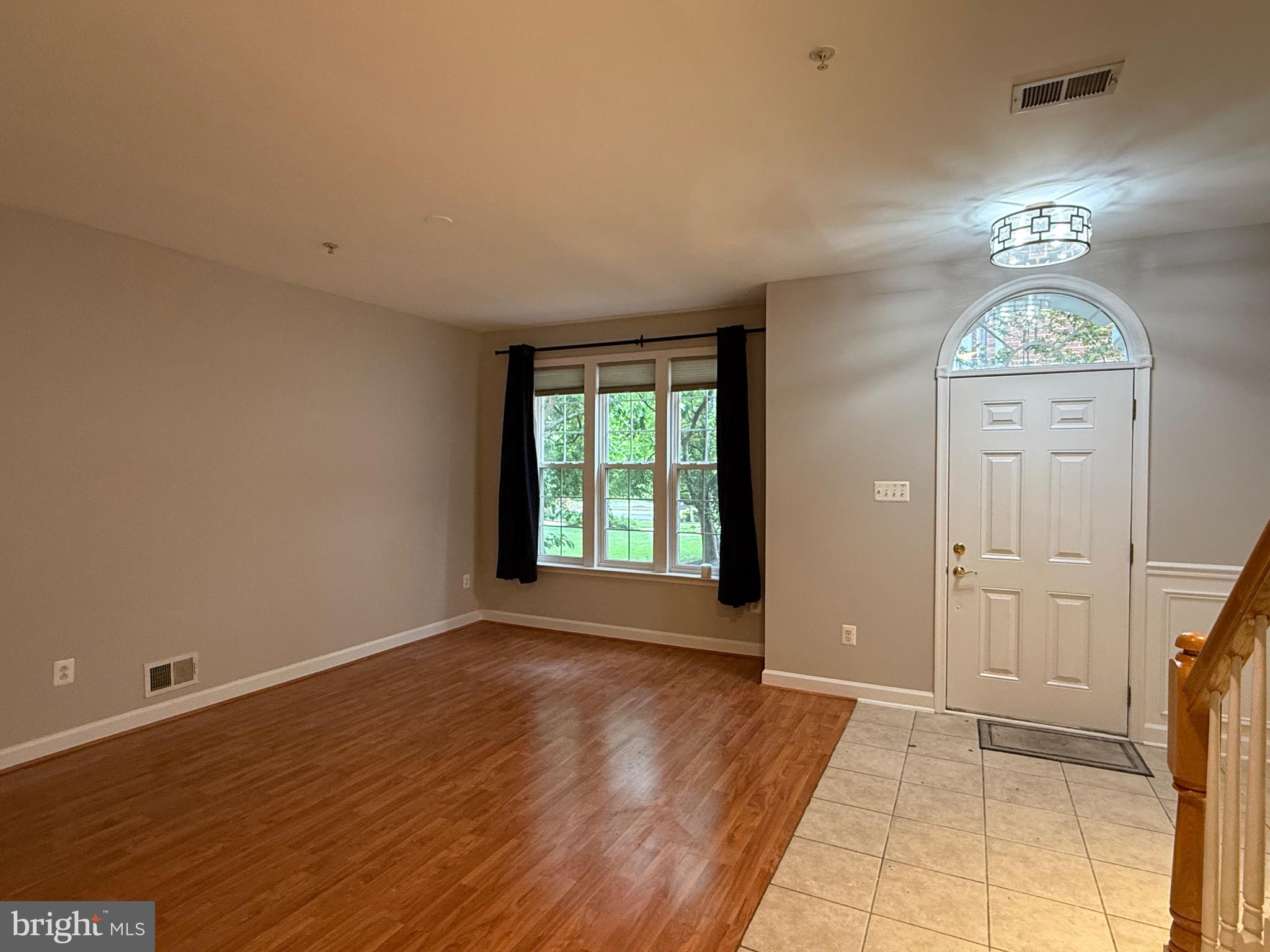1127 Gaither Road Rockville, MD 20850 - Photo 4 of 26 a view of an empty room with a window