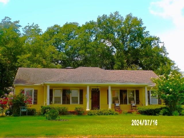 3249 Clarke Road Memphis, TN 38115 - Photo 1 of 24 a view of a white house with a big yard and potted plants and trees