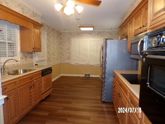 3249 Clarke Road Memphis, TN 38115 - Photo 7 of 24 a kitchen with stainless steel appliances granite countertop a sink a stove and a refrigerator