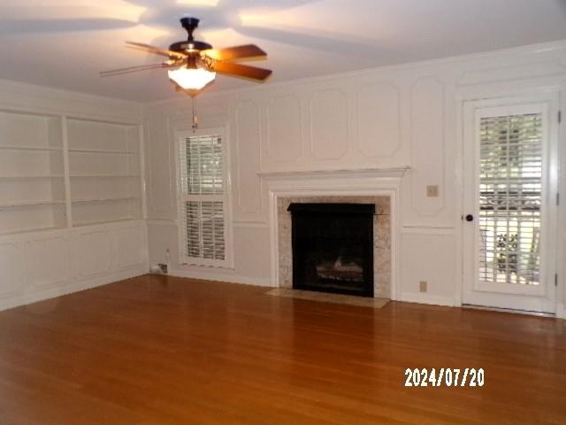 3249 Clarke Road Memphis, TN 38115 - Photo 9 of 24 a view of an empty room with a fireplace and a window