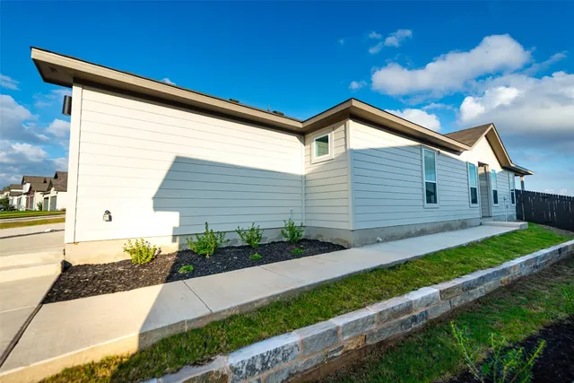 a backyard of a house with lots of green space