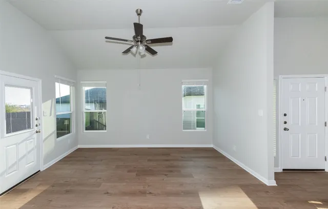 a view of an empty room with a window