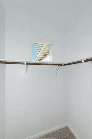 a view of an empty walk in closet