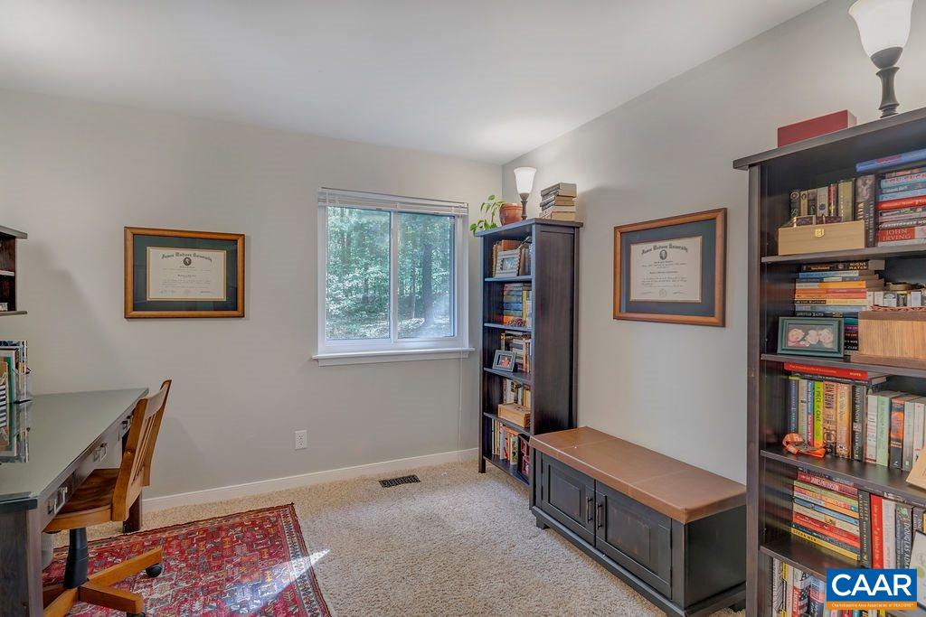 2608 Rio Mills Road Earlysville, VA 22936 - Photo 13 of 38 a room with furniture and a book shelf