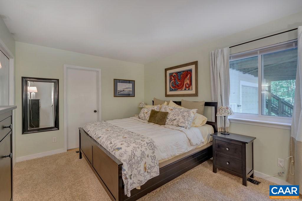 2608 Rio Mills Road Earlysville, VA 22936 - Photo 18 of 38 a bedroom with a bed and a painting on the wall