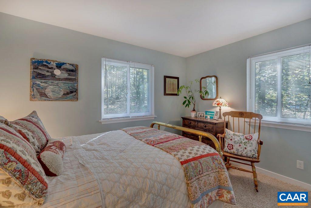 2608 Rio Mills Road Earlysville, VA 22936 - Photo 19 of 38 a bedroom with a bed and a large window