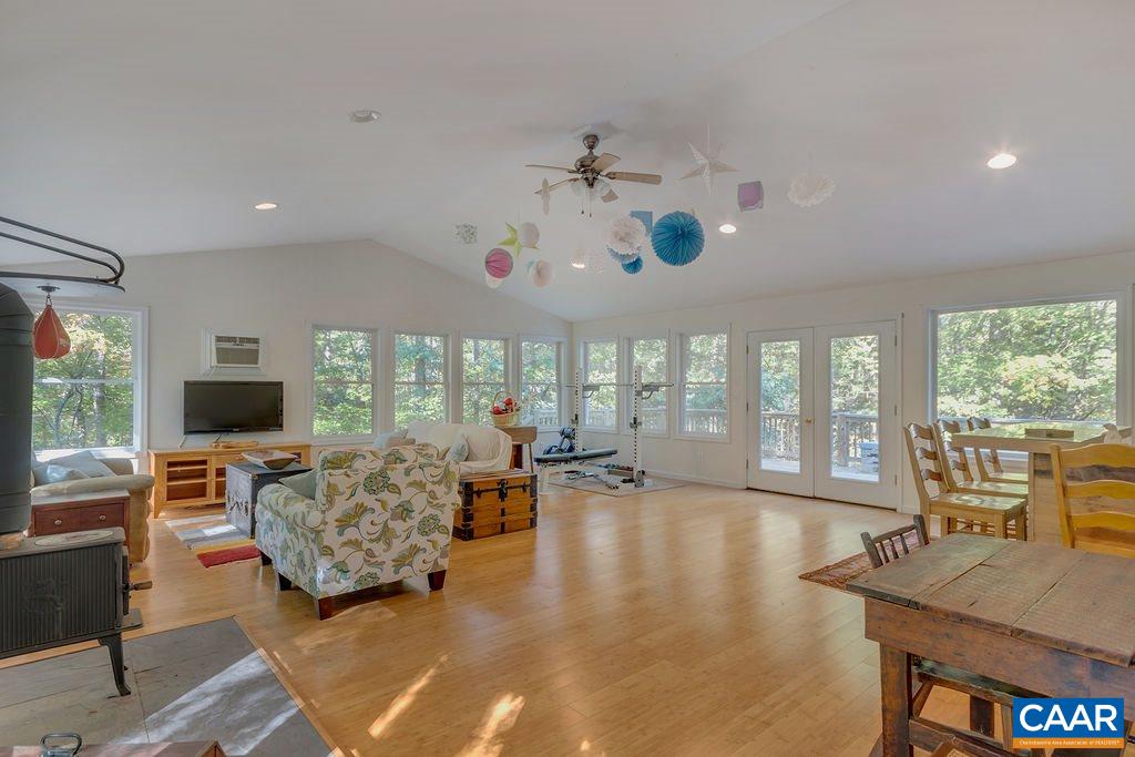 2608 Rio Mills Road Earlysville, VA 22936 - Photo 20 of 38 a living room with furniture and a flat screen tv
