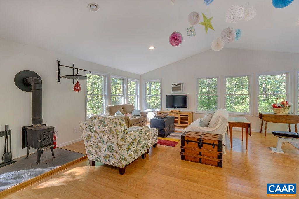 2608 Rio Mills Road Earlysville, VA 22936 - Photo 21 of 38 a living room with furniture and a large window