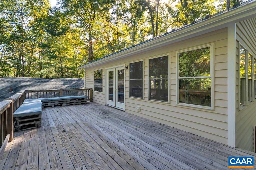 2608 Rio Mills Road Earlysville, VA 22936 - Photo 26 of 38 a view of backyard with deck and wooden floor