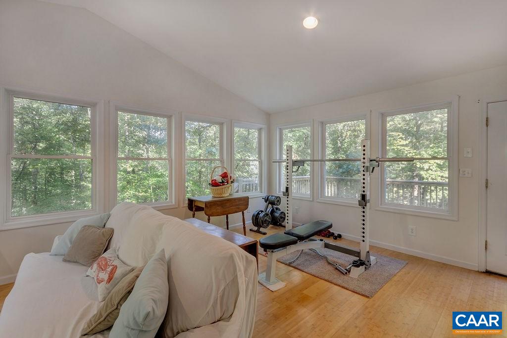 2608 Rio Mills Road Earlysville, VA 22936 - Photo 27 of 38 a living room with furniture and floor to ceiling windows