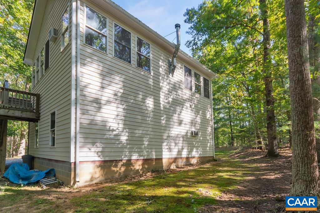 2608 Rio Mills Road Earlysville, VA 22936 - Photo 32 of 38 a view of a house with a yard