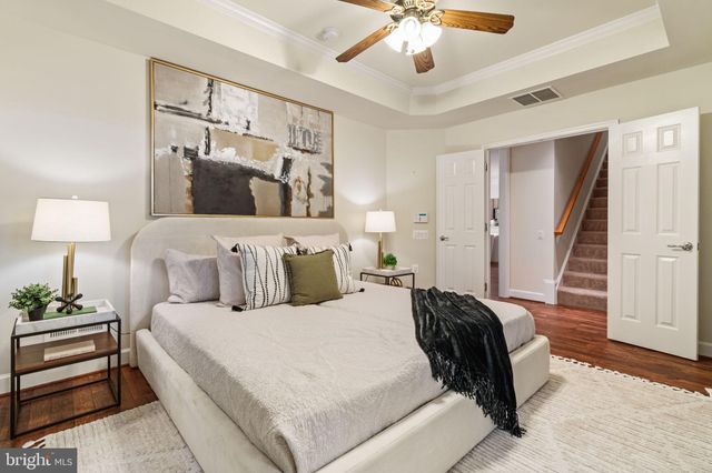 a bed room with a bed and a lamp