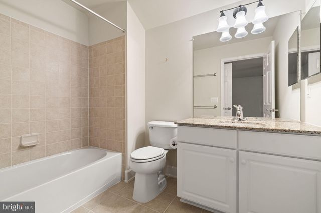 a bathroom with a sink a toilet and a bathtub