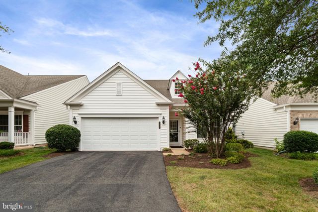 a view of backyard of house along with trees