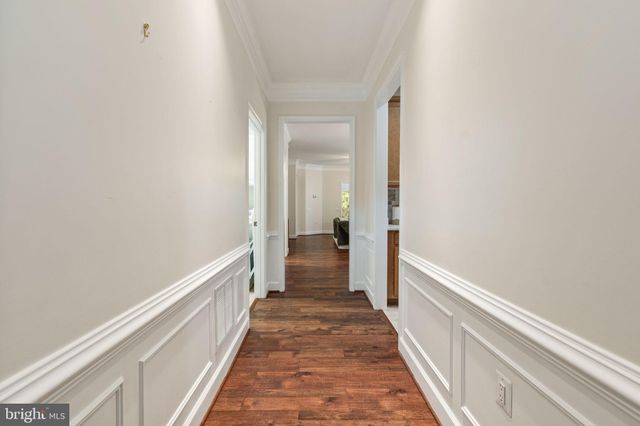 a view of a hallway with a white walls