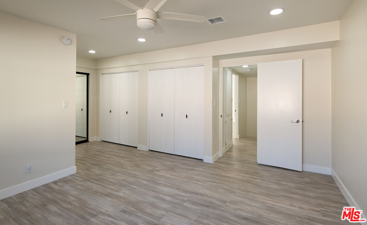 13206 Admiral Avenue, Unit F Marina del Rey, CA 90292 - Photo 14 of 21 an empty room with wooden floor and windows