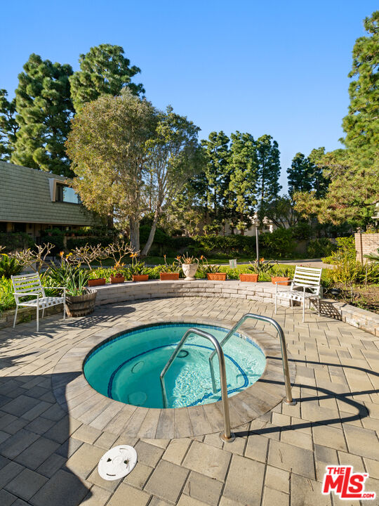 13206 Admiral Avenue, Unit F Marina del Rey, CA 90292 - Photo 19 of 21 a view of a swimming pool with outdoor seating