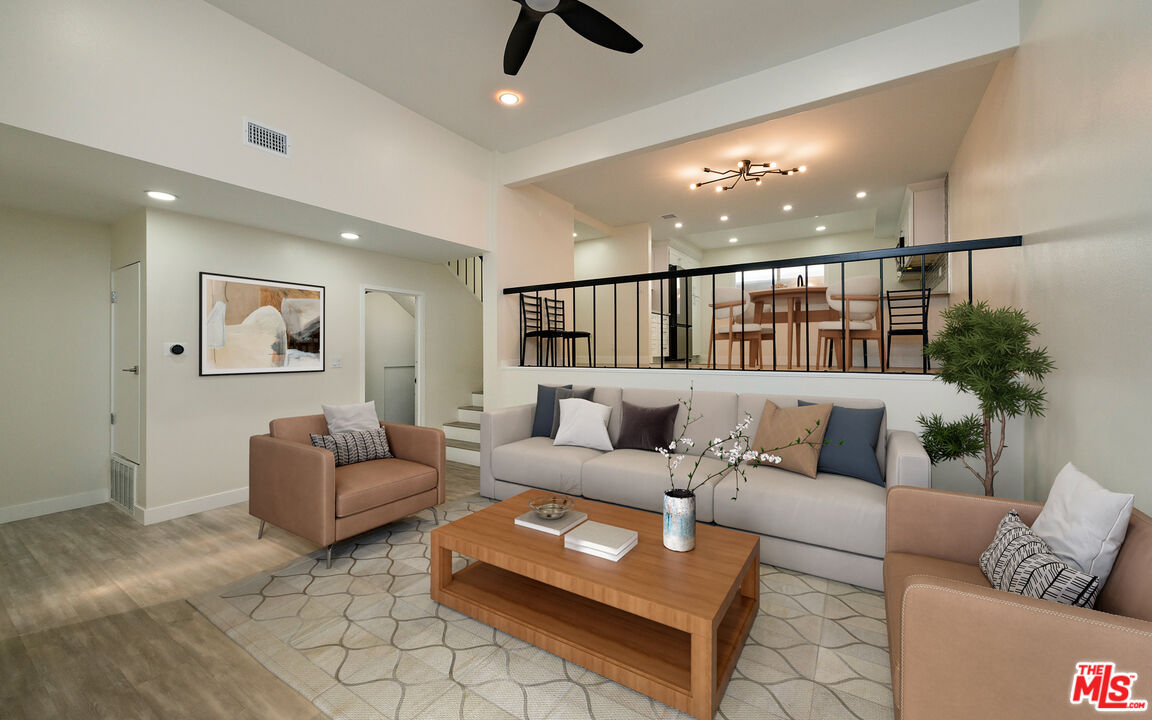 13206 Admiral Avenue, Unit F Marina del Rey, CA 90292 - Photo 2 of 21 a living room with furniture and a ceiling fan