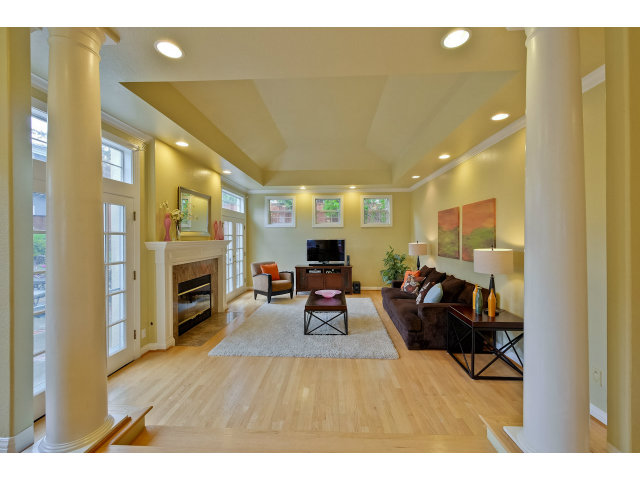 10171 Carmen Road Cupertino, CA 95014 - Photo 11 of 25 a living room with furniture and a fireplace