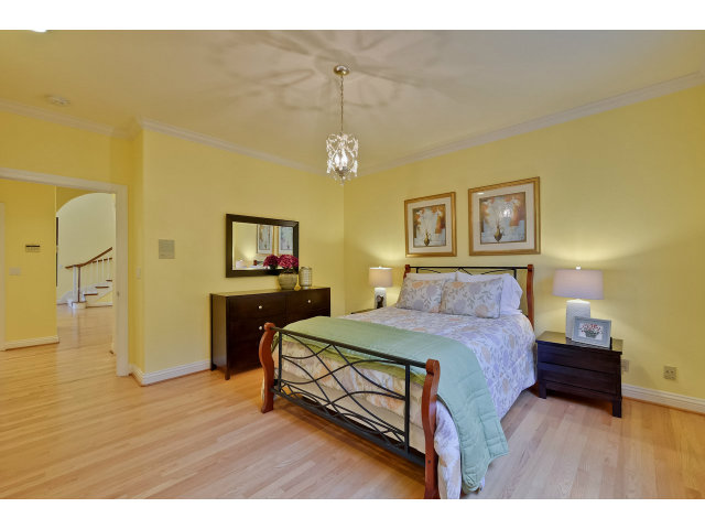 10171 Carmen Road Cupertino, CA 95014 - Photo 17 of 25 a bedroom with a bed and a table in it