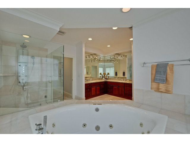 10171 Carmen Road Cupertino, CA 95014 - Photo 20 of 25 a bathroom with a sink a toilet and shower