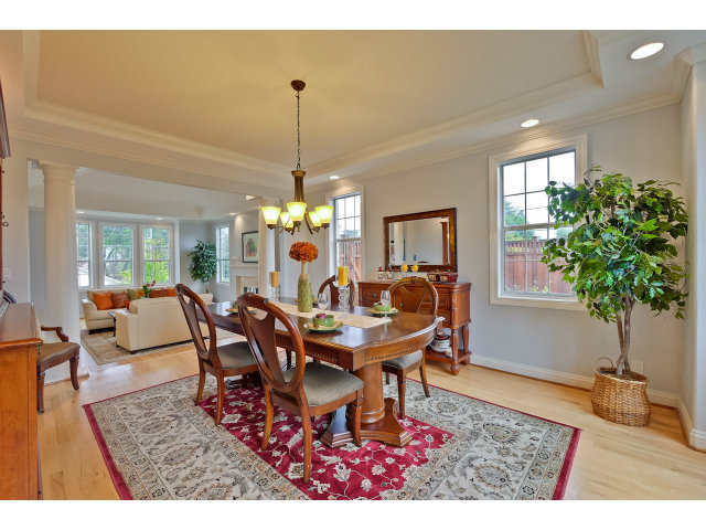 10171 Carmen Road Cupertino, CA 95014 - Photo 8 of 25 a dining room with furniture potted plants and wooden floor