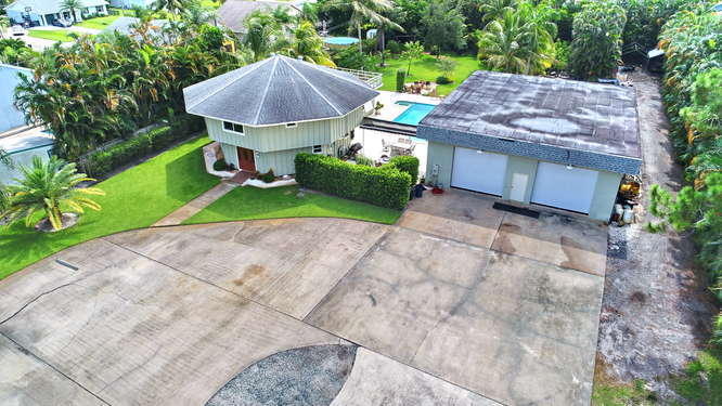 5605 2nd Road Lake Worth, FL 33467 - Photo 23 of 30 a view of house with backyard and outdoor seating